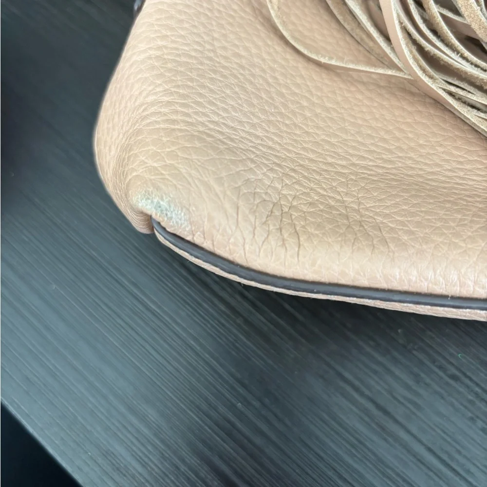 Tory Burch Pebbled Leather Tassel Crossbody in Beige